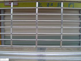 Cửa cuốn TT thương mại - sp song ngang tròn inox